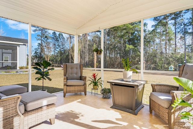 sunroom / solarium with vaulted ceiling