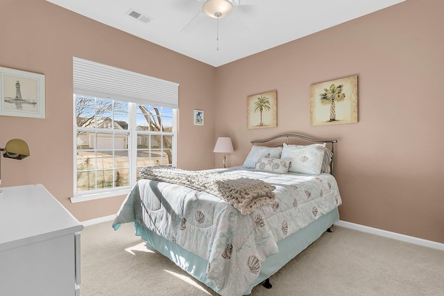 bedroom with ceiling fan and light colored carpet