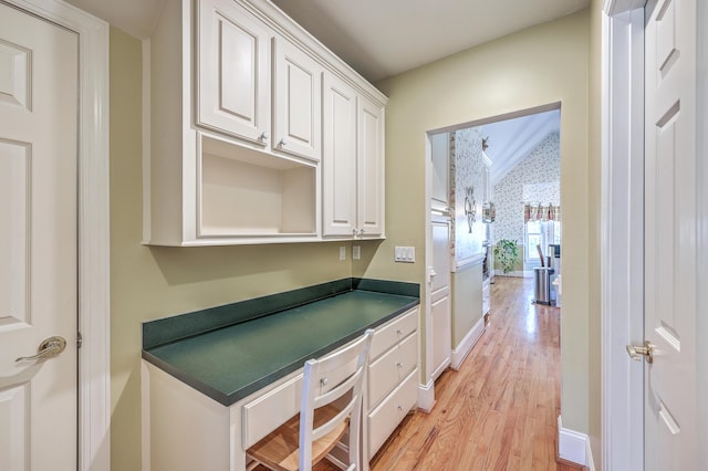 kitchen featuring light hardwood / wood-style floors and white cabinetry