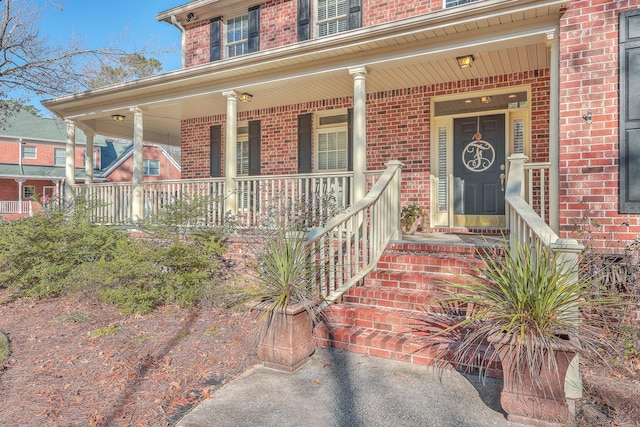 doorway to property featuring covered porch