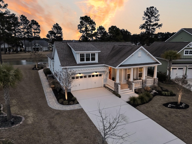 view of front of property with a garage and a porch