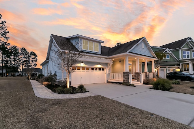 craftsman-style home with a garage and covered porch