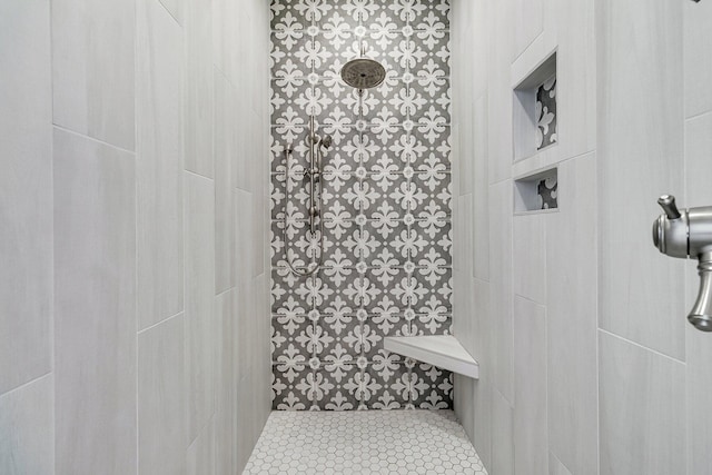 bathroom with tiled shower