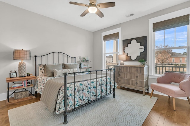 bedroom featuring light hardwood / wood-style floors and ceiling fan