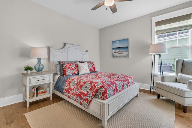 bedroom featuring hardwood / wood-style flooring and ceiling fan