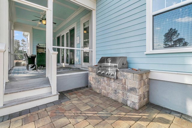 view of patio / terrace featuring an outdoor kitchen, a grill, and ceiling fan