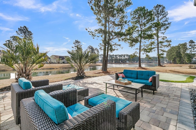 view of patio featuring a water view and outdoor lounge area