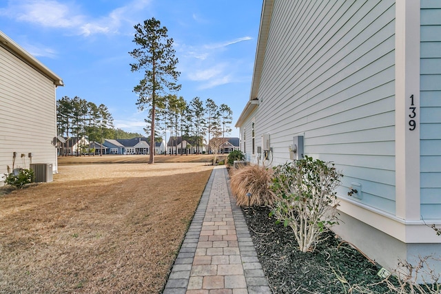 view of yard with central AC unit