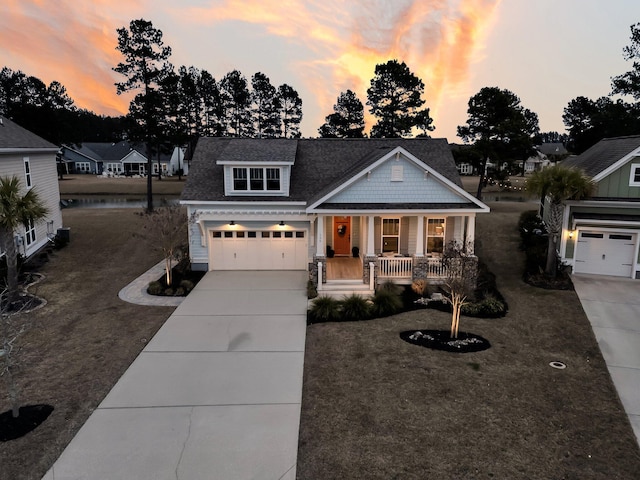 craftsman house with a porch and a lawn