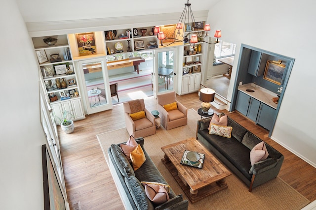 1511 Fairway Dr, Charleston, SC 29412 - living room featuring wood finished floors, a chandelier, and baseboards