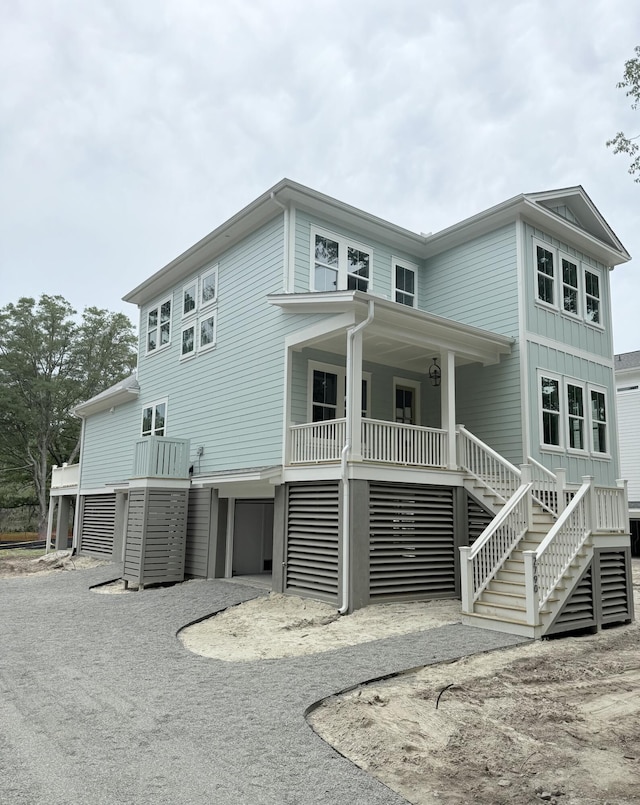 2790 Burden Creek Rd, Johns Island, SC 29455 - back of house featuring stairs, covered porch, and driveway