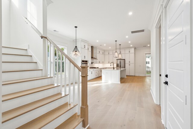 2790 Burden Creek Rd, Johns Island, SC 29455 - entryway featuring recessed lighting, baseboards, stairway, light wood-style flooring, and ornamental molding