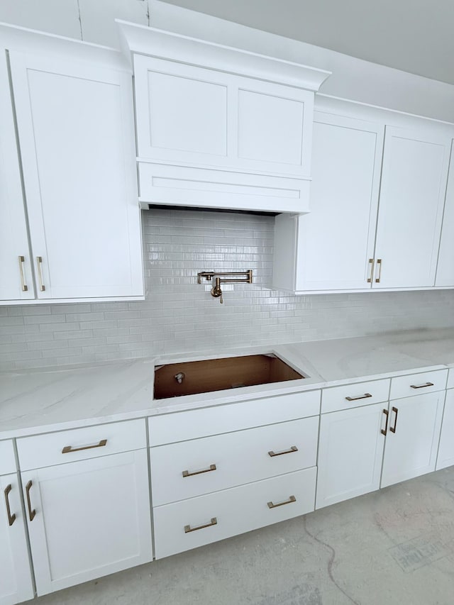 2790 Burden Creek Rd, Johns Island, SC 29455 - kitchen featuring a sink, white cabinetry, and tasteful backsplash