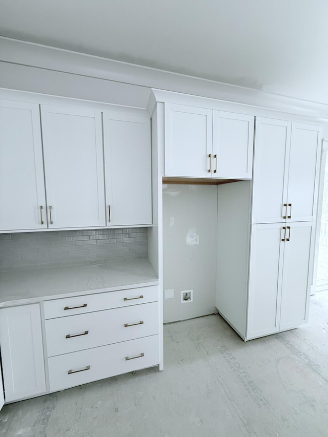 2790 Burden Creek Rd, Johns Island, SC 29455 - kitchen with white cabinets, light countertops, and tasteful backsplash