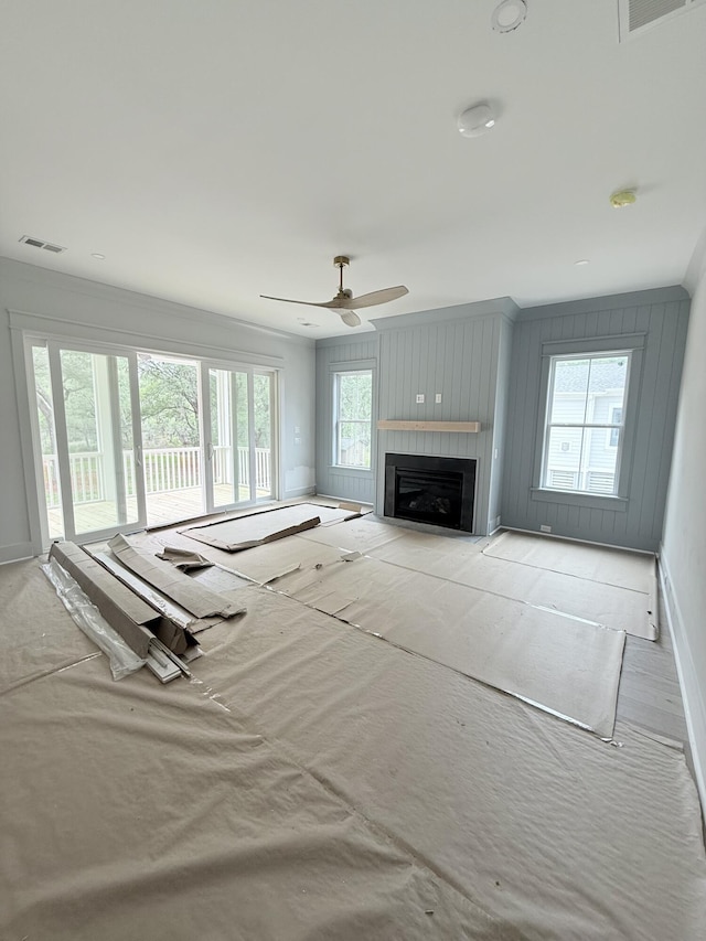 2790 Burden Creek Rd, Johns Island, SC 29455 - living area with baseboards, ceiling fan, a fireplace, and crown molding