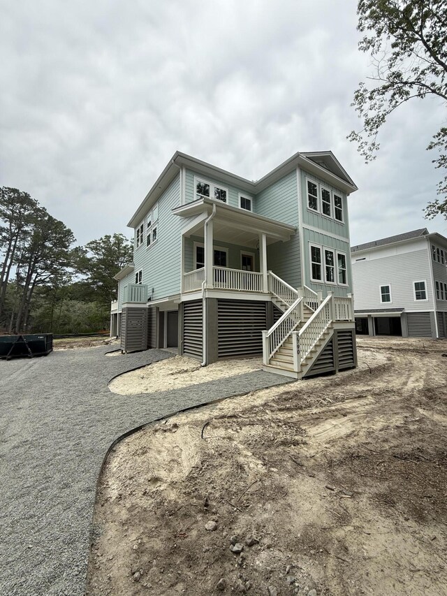 2790 Burden Creek Rd, Johns Island, SC 29455 - rear view of property featuring stairs, a porch, and central AC