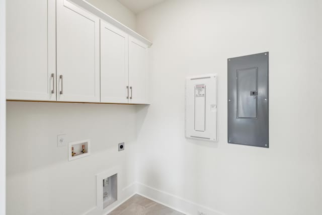 2790 Burden Creek Rd, Johns Island, SC 29455 - laundry room featuring electric panel, electric dryer hookup, cabinet space, baseboards, and washer hookup