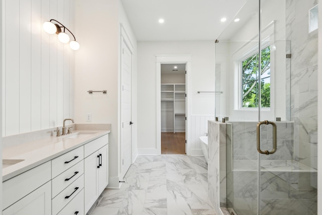 2790 Burden Creek Rd, Johns Island, SC 29455 - full bathroom featuring marble look tiles, double vanity, a freestanding bath, a marble finish shower, and a walk in closet