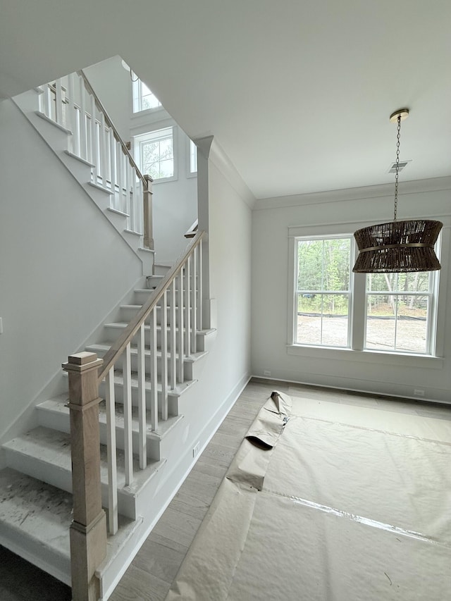 2790 Burden Creek Rd, Johns Island, SC 29455 - stairs with wood finished floors, baseboards, and ornamental molding