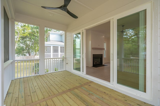 2790 Burden Creek Rd, Johns Island, SC 29455 - unfurnished sunroom featuring ceiling fan, hardwood / wood-style flooring, and a deck