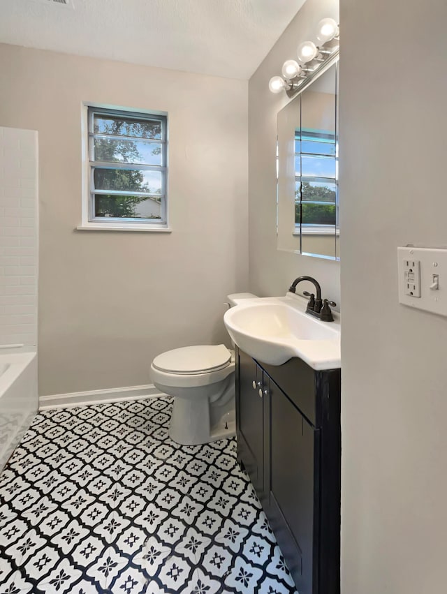 bathroom with vanity and toilet