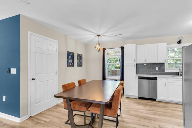334 Water Oak Dr, Goose Creek, SC 29445 - dining space with light wood-type flooring, plenty of natural light, and baseboards