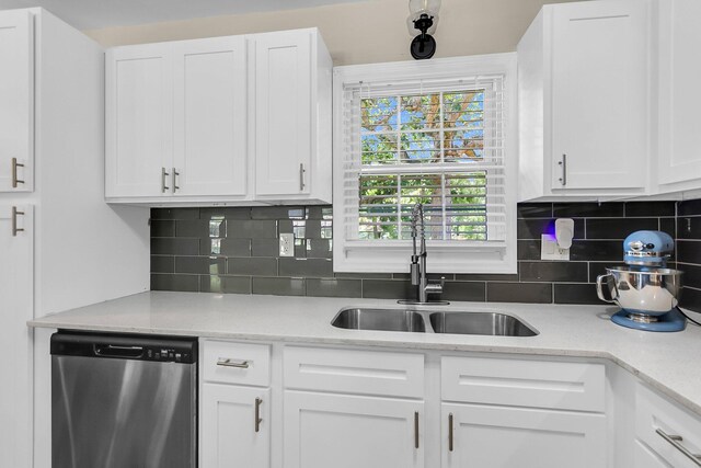 334 Water Oak Dr, Goose Creek, SC 29445 - kitchen with stainless steel dishwasher, a sink, white cabinetry, and decorative backsplash