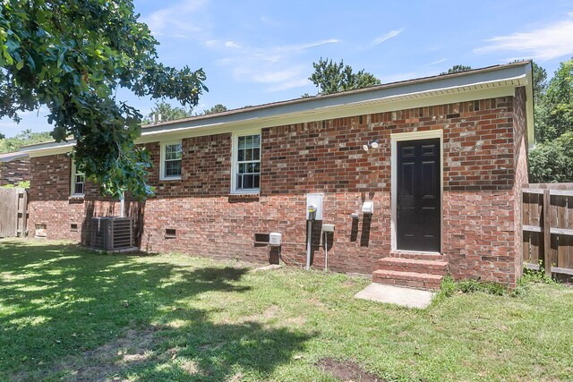 334 Water Oak Dr, Goose Creek, SC 29445 - back of property with entry steps, crawl space, central AC unit, and brick siding