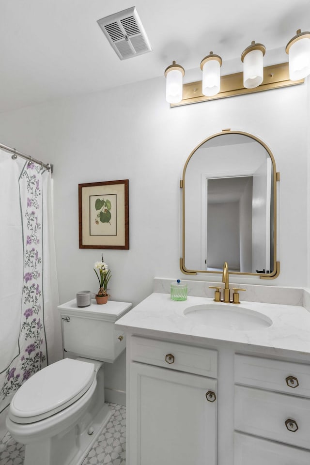 full bathroom with toilet, vanity, tile patterned floors, and a shower with shower curtain