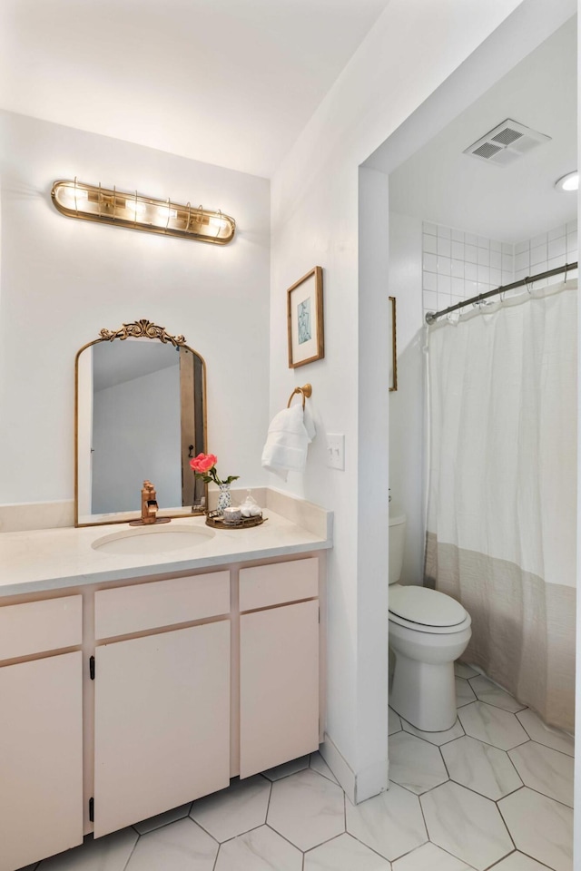 bathroom with vanity, toilet, a shower with shower curtain, and tile patterned flooring