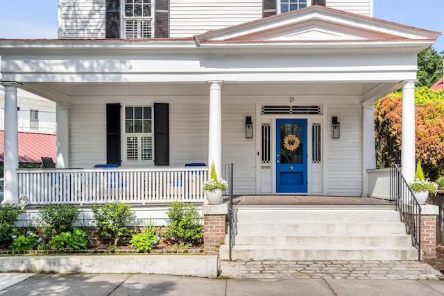 doorway to property with covered porch