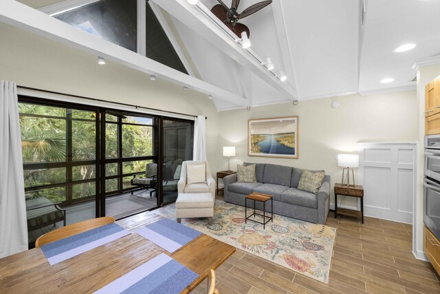 living room with beam ceiling, hardwood / wood-style flooring, high vaulted ceiling, and ceiling fan