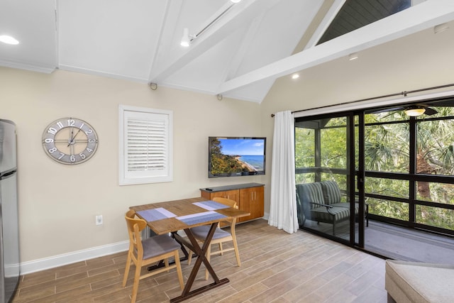 dining space with light hardwood / wood-style floors, beam ceiling, and high vaulted ceiling