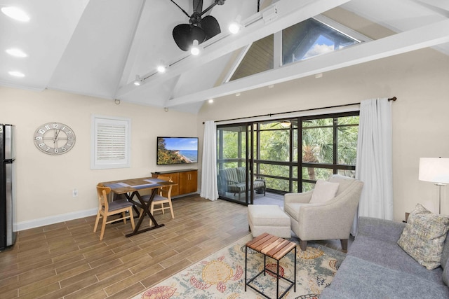 living room with beamed ceiling, hardwood / wood-style flooring, high vaulted ceiling, and ceiling fan