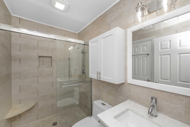 bathroom featuring a shower with door, tile walls, and tasteful backsplash