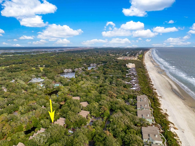 bird's eye view with a water view and a beach view