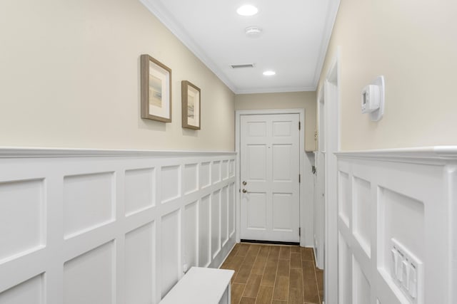 hall featuring crown molding and dark wood-type flooring