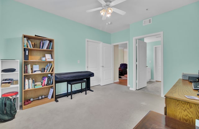 misc room featuring light carpet and ceiling fan