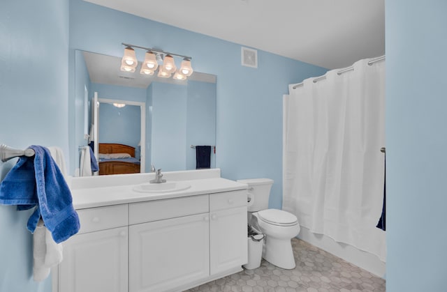 full bathroom featuring vanity, toilet, and shower / tub combo