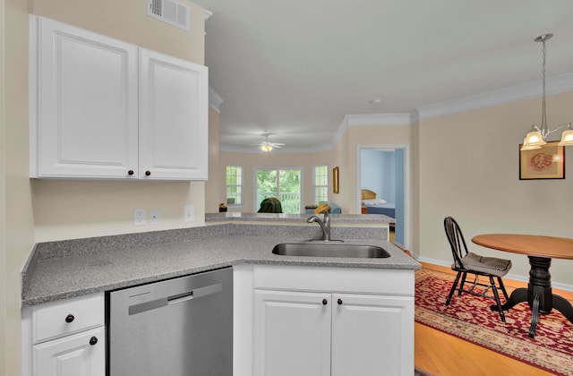 kitchen with dishwasher, ceiling fan with notable chandelier, crown molding, and white cabinets