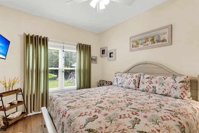 bedroom with wood-type flooring and ceiling fan