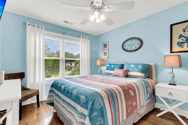 bedroom with hardwood / wood-style flooring and ceiling fan