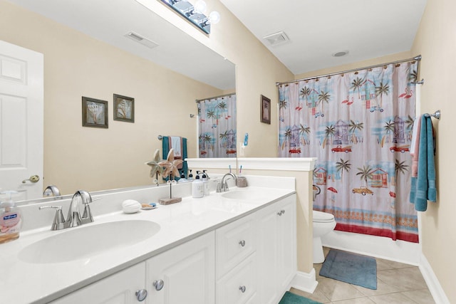 full bathroom featuring vanity, toilet, tile patterned flooring, and shower / bath combo