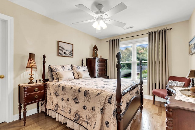 bedroom with ceiling fan and light hardwood / wood-style floors