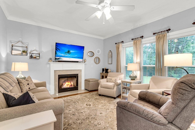 living room featuring crown molding and ceiling fan