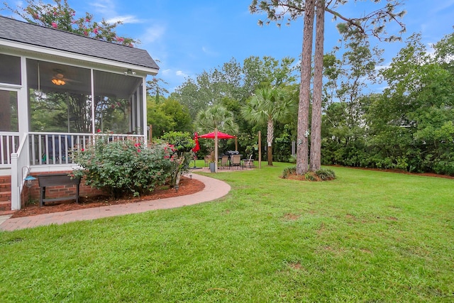 view of yard featuring a sunroom