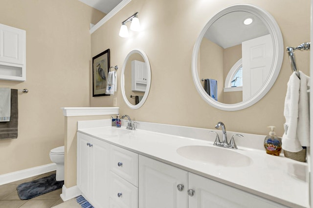 bathroom featuring tile patterned flooring, vanity, and toilet