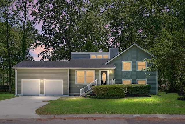 105 Brailsford Rd, Summerville, SC 29485 - split level home with an attached garage, a lawn, a chimney, and driveway