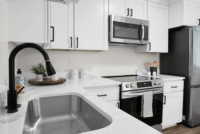 105 Brailsford Rd, Summerville, SC 29485 - kitchen with white cabinets, stainless steel appliances, and a sink