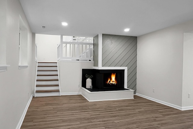 105 Brailsford Rd, Summerville, SC 29485 - unfurnished living room with baseboards, wood finished floors, stairs, and recessed lighting